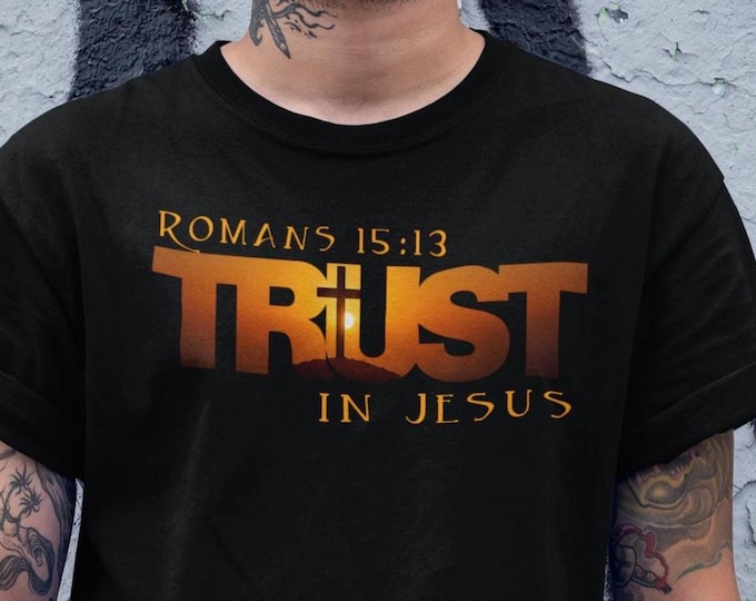 Featured listing image: Christian T Shirt Trust In Jesus Romans 15:13 Scripture Verse Tees The Cross on Calvary with Sunset