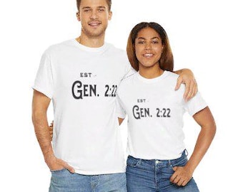 May include: Two white t-shirts with the text "EST. GEN. 2:22" printed on them. The shirts are being modeled by two people.
