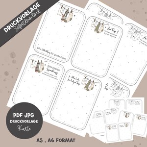 May include: A collection of printable cards with a baby theme. Each card features a dotted border, a clothesline with hanging socks, and German text. The cards are in A5 and A6 formats, with the words "PDF JPG DRUCKVORLAGE Karte" visible.