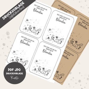 May include: Printable cards with a floral design and the German text "Blümelein". The cards feature illustrations of flowers, butterflies, and gardening tools. The cards are available as a PDF and JPG file.