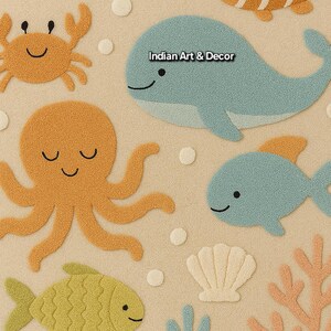 May include: A tufted rug featuring a beige background with various sea creatures including an orange octopus, a blue whale with the text Indian Art & Decor, a yellow fish, a crab, and coral. The design includes white clouds and bubbles.