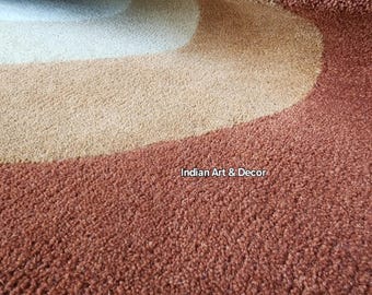 Handgetuft retro rond vloerkleed – middeleeuws modern concentrisch cirkeltapijt in warme aardetinten. Handgemaakt wollen tapijt