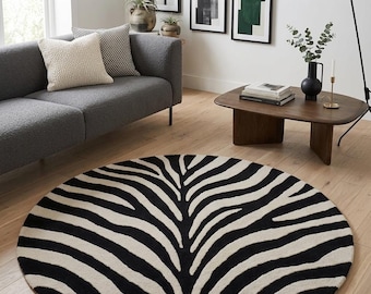 Rond handgetuft vloerkleed met zebraprint: modern zwart en beige dierenpatroon