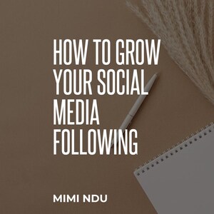 May include: A brown background with a white pen and a notebook with a spiral binding. The text "HOW TO GROW YOUR SOCIAL MEDIA FOLLOWING" is written in black text. Below the text is the name "MIMI NDU" in black text.