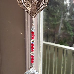 Sending love suncatcher with ruby red beads, swarovski crystal, and a crystal prism that sends rainbows across the room when the sun shines