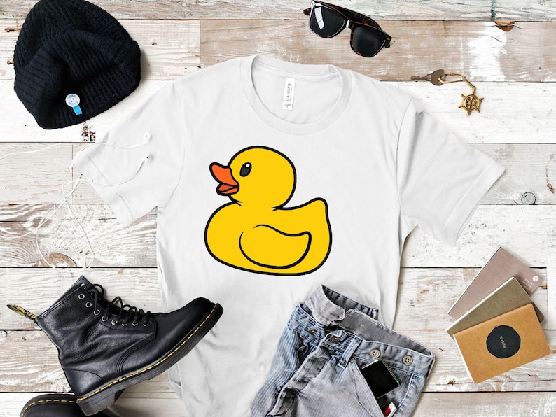 May include: White t-shirt with a yellow rubber duck illustration.