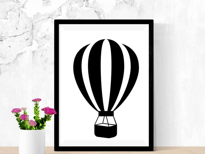 May include: Black and white silhouette of a hot air balloon with stripes. The balloon is in a black frame against a white background.
