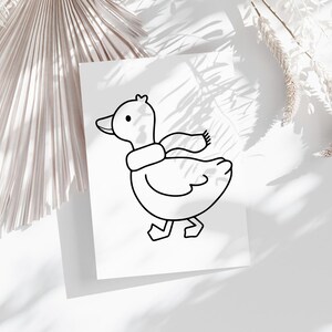 May include: A black and white line drawing of a duck wearing a scarf. The duck is facing to the right and has its head tilted slightly to the side. The duck is walking with its right leg forward.