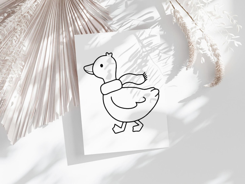 May include: A black and white line drawing of a duck wearing a scarf. The duck is facing to the right and has its head tilted slightly to the side. The duck is walking with its right leg forward.