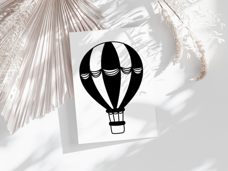 May include: Black and white hot air balloon illustration on a white background.