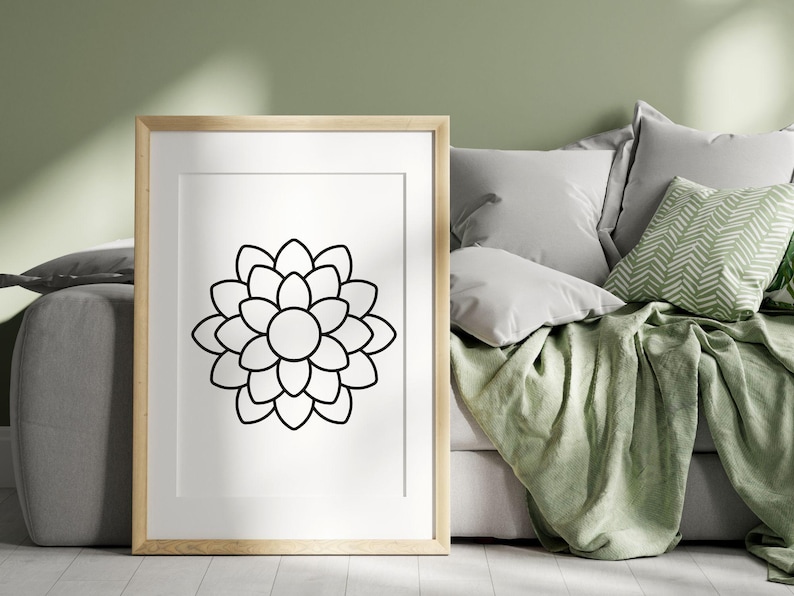 Pode incluir: Um desenho a preto e branco de uma flor com m&uacute;ltiplas p&eacute;talas, emoldurado numa moldura de madeira clara. A moldura est&aacute; sobre uma superf&iacute;cie branca.