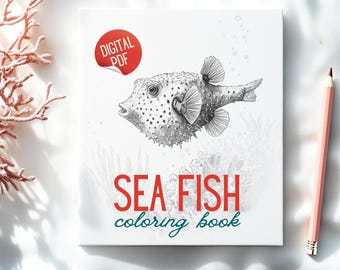Op de afbeelding: Een wit kleurboek met een gedetailleerde illustratie van een kogelvis. De omslag heeft de tekst "SEA FISH coloring book" in rood en teal. Een rode sticker met "DIGITAL PDF" staat linksboven. Een roze potlood ligt rechts.