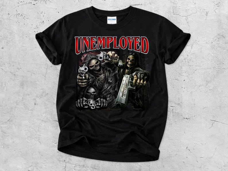 May include: Black t-shirt with the word "UNEMPLOYED" in red and white lettering. The graphic features skeletal figures holding guns. The shirt is made of a soft material.