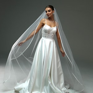 Elegant wedding veil with satin edge – long fingertip-length veil with ribbon trim | Classic chapel-style veil