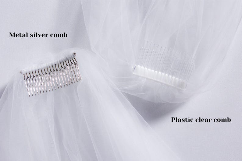 May include: Two white tulle veils with different combs. One veil has a metal silver comb, and the other has a plastic clear comb. The text "Metal silver comb" is above the silver comb and the text "Plastic clear comb" is below the clear comb.