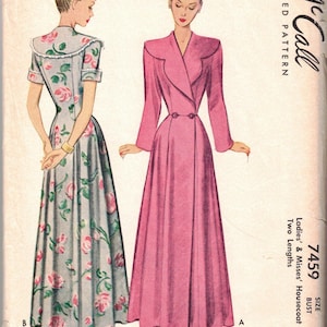 May include: A McCall printed pattern envelope for a housecoat, number 7459, size 32 bust. The illustration shows two floor-length housecoat designs: one in solid pink with long sleeves and a collar, and one in gray with a pink rose floral print.