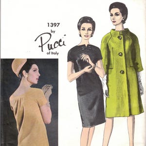 May include: A Vogue Couturier Design sewing pattern envelope 1397 by Pucci of Italy. The cover features illustrations of a black short-sleeved dress and a lime green coat with three buttons, alongside a photograph of a tan dress and matching hat.