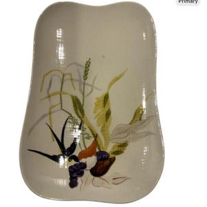 May include: A set of three ceramic mugs with a speckled, matte finish. The mugs are in shades of cream, light gray, and dark gray. Each mug has a simple, minimalist design, perfect for coffee or tea.