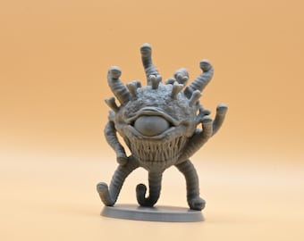 May include: A gray 3D printed miniature of a beholder, a creature with a large central eye and multiple smaller eyes, tentacles, and a toothy mouth.