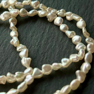 Japanese Akoya Keshi Pearls: Cream Platinum Petite Pearls (8)