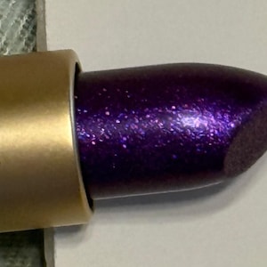 May include: A set of three ceramic mugs with a speckled, matte finish. The mugs are in shades of cream, light gray, and dark gray. Each mug has a simple, minimalist design and a rounded handle. Perfect for coffee or tea.