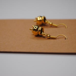 Gold witches brew earrings. Gold cauldron accessory. Witch inspired jewelry. Halloween accessories.
