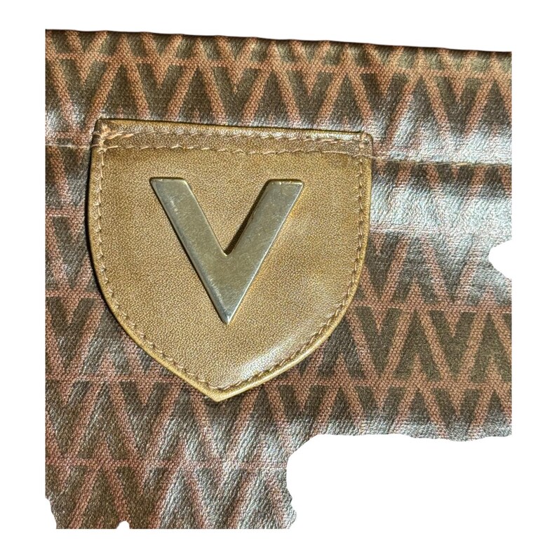 May include: A brown leather pouch with a silver V logo. The pouch has a brown and white patterned fabric with a repeating V pattern.
