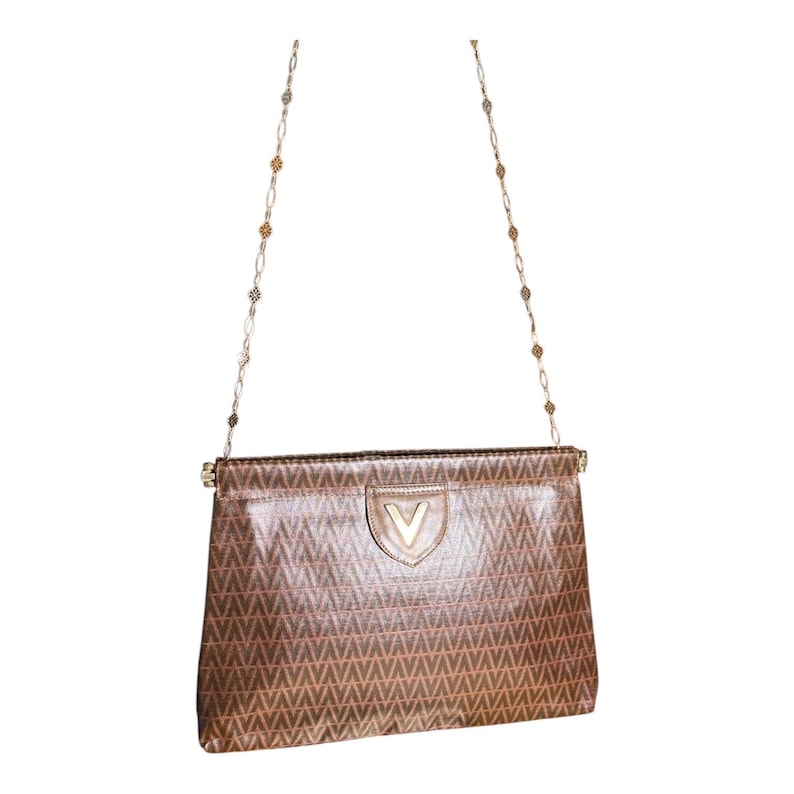 May include: A brown leather shoulder bag with a gold chain strap and a gold V logo on the front.