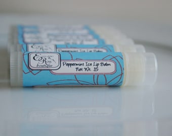 May include: A close-up of a blue and white lip balm tube with the text "Peppermint Ice Lip Balm Net Wt. .15" and the logo "Elegant Rose Boutique".