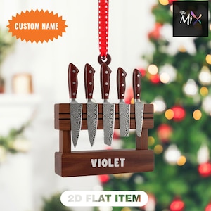 May include: A decorative wooden knife holder with six knives. The knives have patterned blades and dark brown handles. The holder is engraved with the name "VIOLET" and the text "2D FLAT ITEM". A red ribbon is attached for hanging.