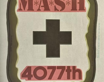 May include: A vintage-style graphic featuring the text "MASH" with asterisks, a large black cross, and "4077th" in red. The design is framed by a brown border and includes the text "HOME AT LAST 1972-1983".