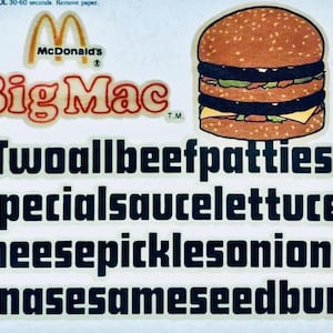 May include: A vintage McDonald's Big Mac advertisement featuring a large, colorful illustration of the iconic burger. The text reads "Two all beef patties special sauce lettuce cheese pickles onions on a sesame seed bun."
