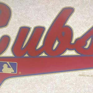 May include: Red and blue "Cubs" logo with a baseball player silhouette in a white diamond. The logo is on a white background with a gold outline.