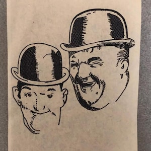 May include: Black and white line drawing of two men wearing bowler hats. The men are smiling and looking at the viewer.