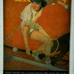 May include: A vintage magazine cover from July 16, 1938, showing a tennis player in action. The cover has an orange background with the word "Liberty" in yellow. The player wears a white tennis outfit and a green visor, holding a racket and a tennis ball.