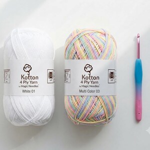 Two skeins of 4-ply yarn in white and multicolored pastel sit next to a pink-handled crochet hook on a white surface.