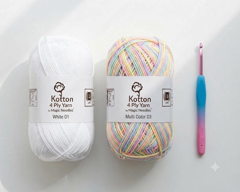 Two skeins of 4-ply yarn in white and multicolored pastel sit next to a pink-handled crochet hook on a white surface.
