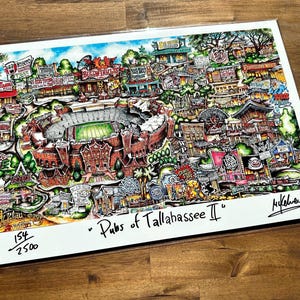 May include: A colorful, hand-drawn illustration of a map of Tallahassee, Florida, with the title "Pubs of Tallahassee II." The map features a stadium, buildings, and various pubs and restaurants. The print is numbered 154/250 and signed by the artist.