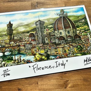 May include: A colorful illustration of the city of Florence, Italy, with the Duomo, a bridge, and a dragon in the foreground. The print is numbered 227/250 and signed by the artist, "M. Kelleher".