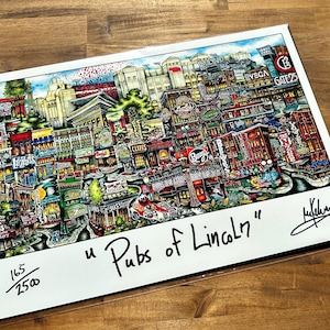 May include: A colorful illustration of a city scene with buildings, streets, and people. The title "Pubs of Lincoln" is written in black cursive at the bottom of the image. The image is numbered 165/250.