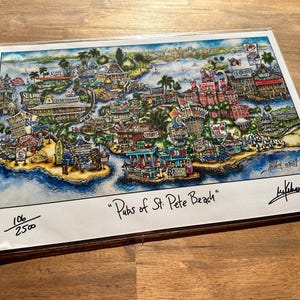 May include: A colorful illustration of a map of St. Pete Beach, Florida, showing the location of various pubs and bars. The map is titled "Pubs of St. Pete Beach" and is numbered 106 of 250. The artist's signature is in the bottom right corner.