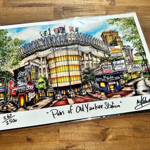 May include: A colorful illustration of the old Yankee Stadium with the text "Pubs of Old Yankee Stadium" and the artist's signature. The illustration is numbered 267/2500.