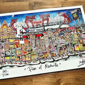 May include: A colorful illustration of a cityscape with buildings and a stadium in the background. The illustration is titled "Pubs of Nashville" and is numbered 167/2500.