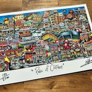 May include: A colorful illustration of a city street scene with many buildings and signs. The image is titled "Pubs of Clifton" and is numbered 189/250.