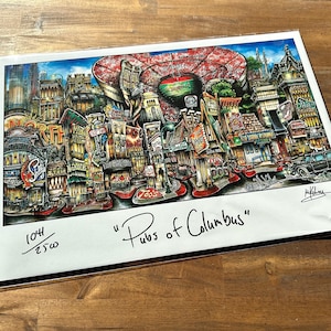 May include: A colorful illustration of a city scene with buildings, streets, and people. The title "Pubs of Columbus" is written in black ink at the bottom of the print. The print is numbered 1044/2500.