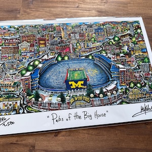 May include: A colorful illustration of the University of Michigan's football stadium, "The Big House", surrounded by buildings and trees. The illustration is titled "Pubs of the Big House" and is numbered 346/1500.