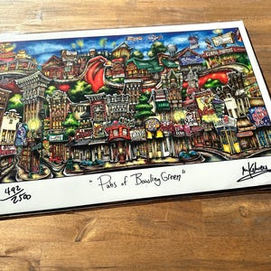 May include: A colorful illustration of a city street scene with buildings, shops, and streetlights. The title "Pubs of Bowling Green" is written below the image. The image is numbered 492/2500.