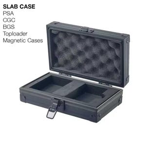 May include: A black rectangular storage case with a metal exterior and a hinged lid. The interior features black egg-crate foam in the lid and a custom-cut foam base with two rectangular compartments. The text SLAB CASE PSA CGC BGS Toploader Magnetic Cases is visible.