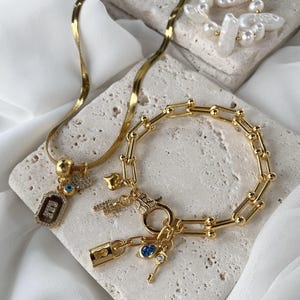 Gold-Plated Charm Necklace and Bracelet Set: Zircon Letter, Heart, Eye