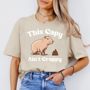 This Capy Aint Crappy, Capybara Pun T-Shirt, Animal Lover Tee, Funny Graphic Tee, Cute Capy Tee, Gift for Pet Owner, Unisex Softstyle Shirt